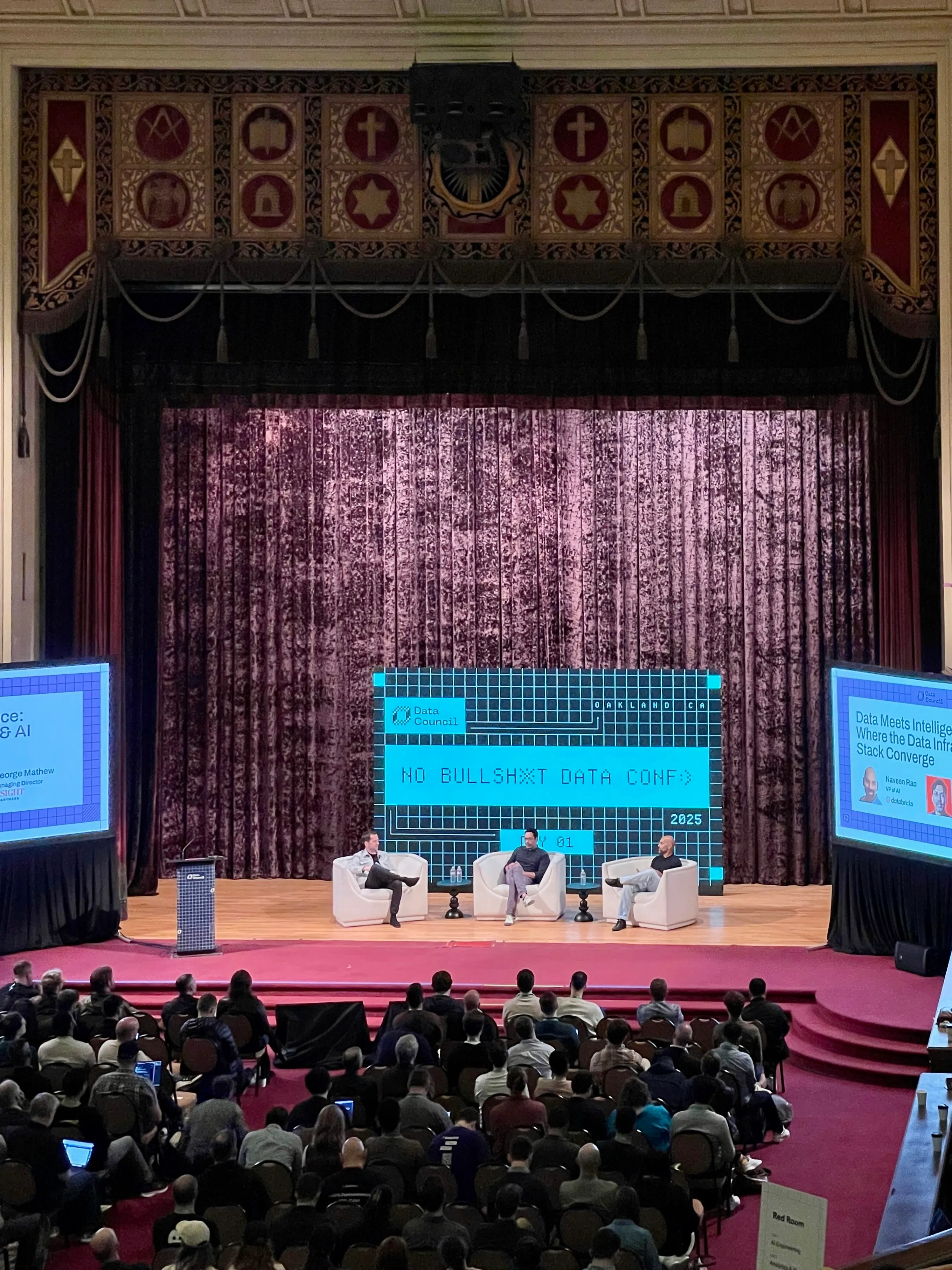 Panel discussion on stage at Data Council 2025 in the Oakland Scottish Rite Center